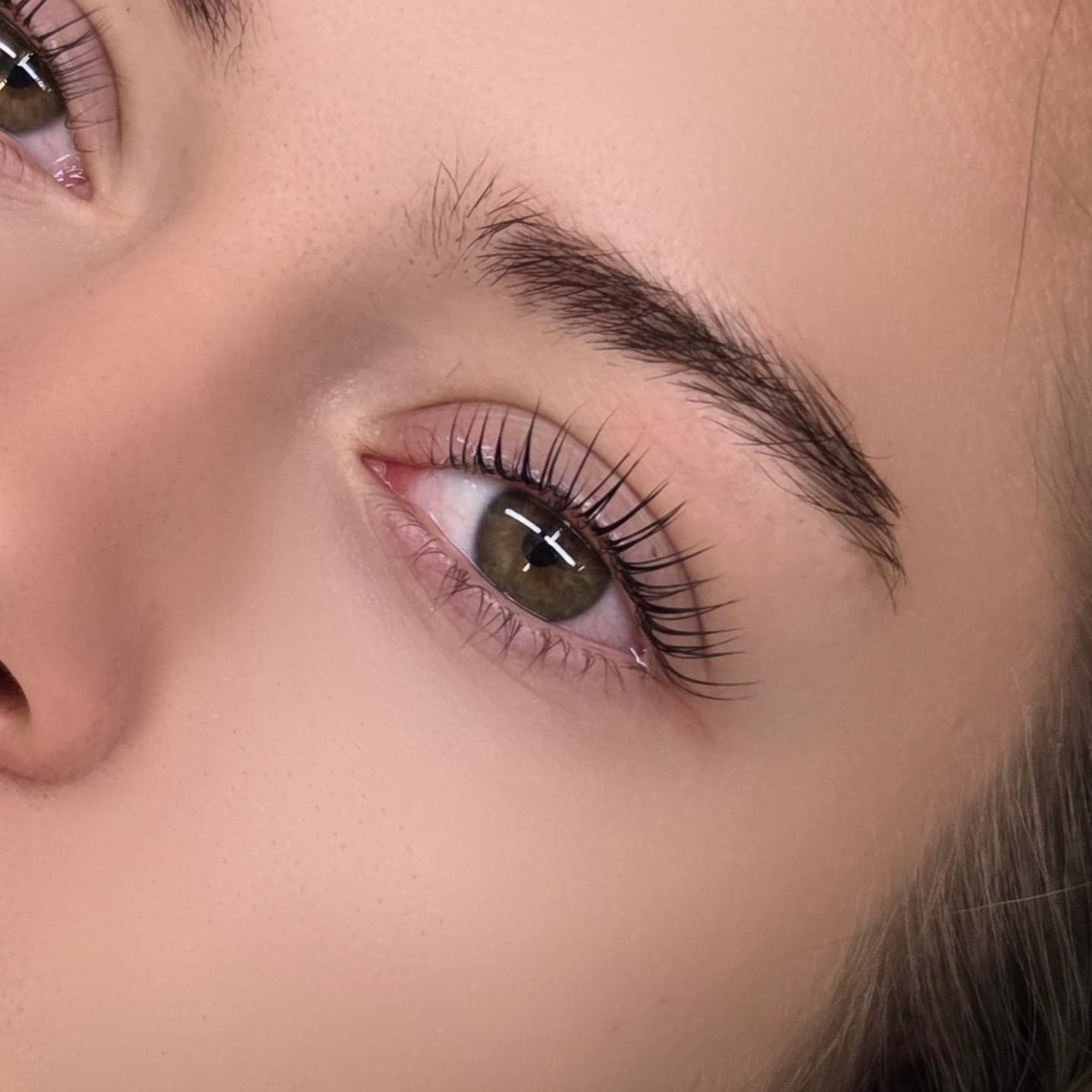 Soft natural lash lift and laminated brow on a green eye by Get Lash and Beauty